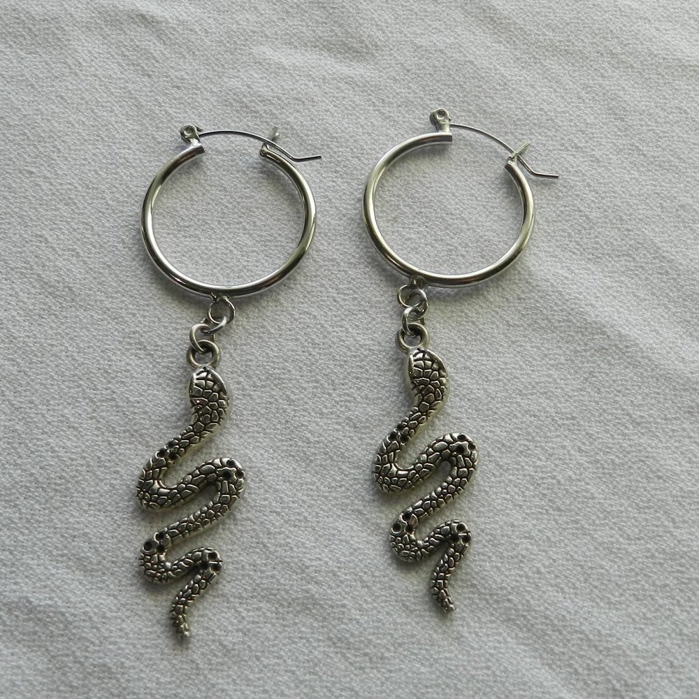 Silvertone hoop and snake earrings, approximately 2.5 inches long